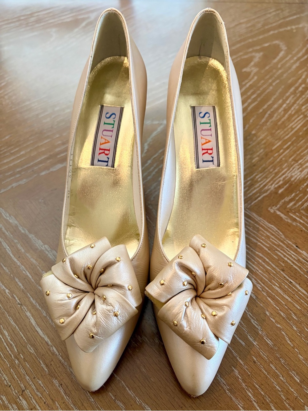 Stuart Weitzman Pearl Bow Pointy Pumps in Light Beige with Gold Studs